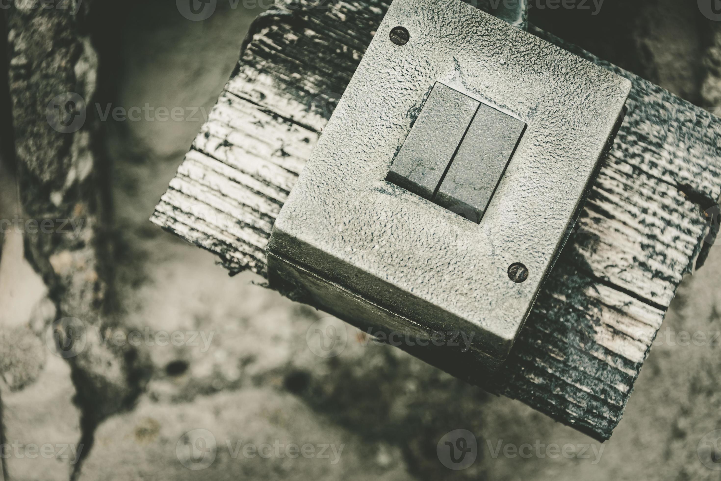 an old broken light switch in a lostplace in selective focus 9000775
