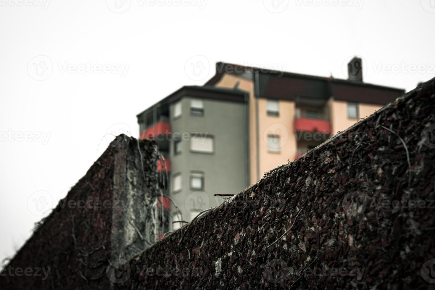 houses with a stone wall in the foreground photo