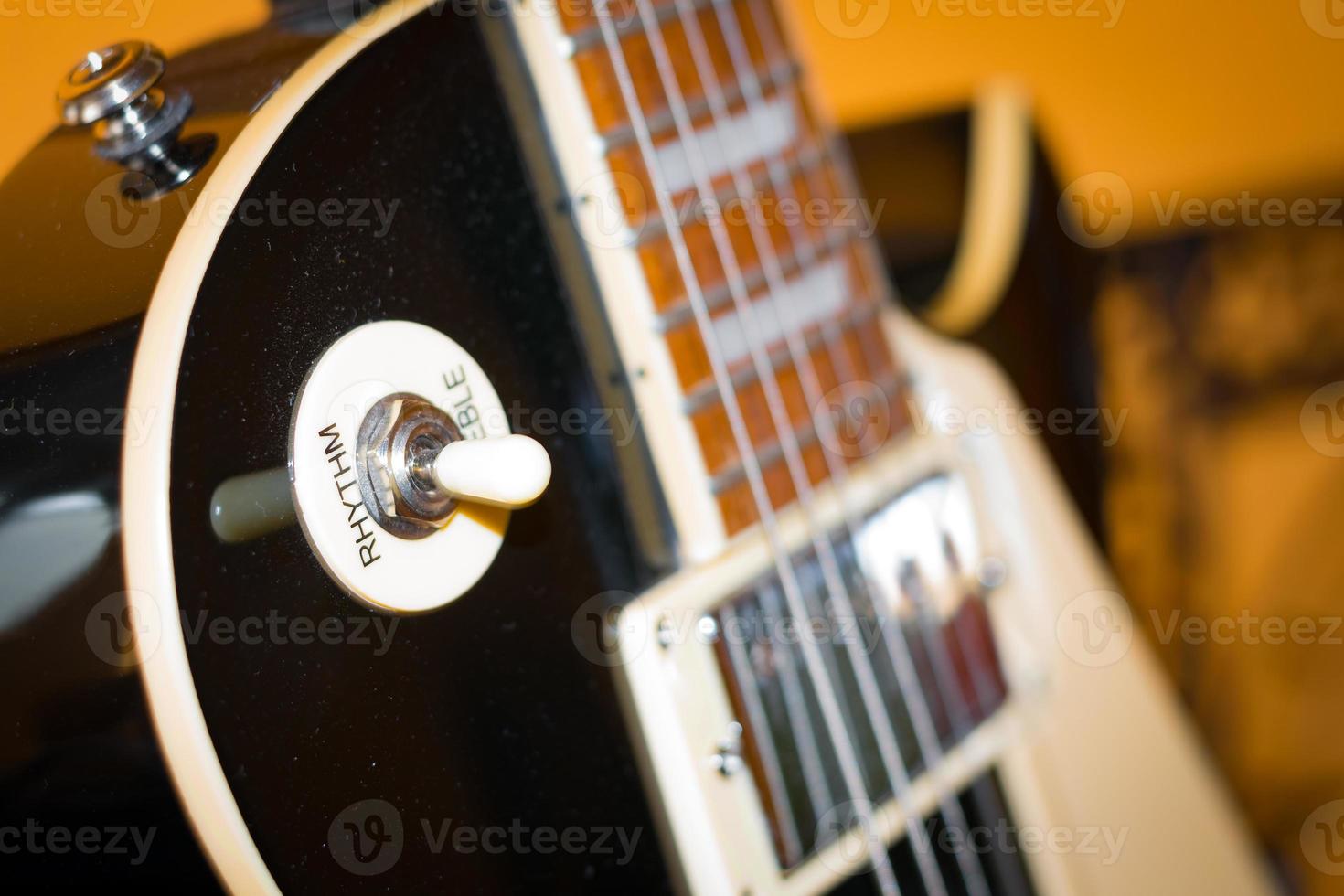 black guitar closeup photo