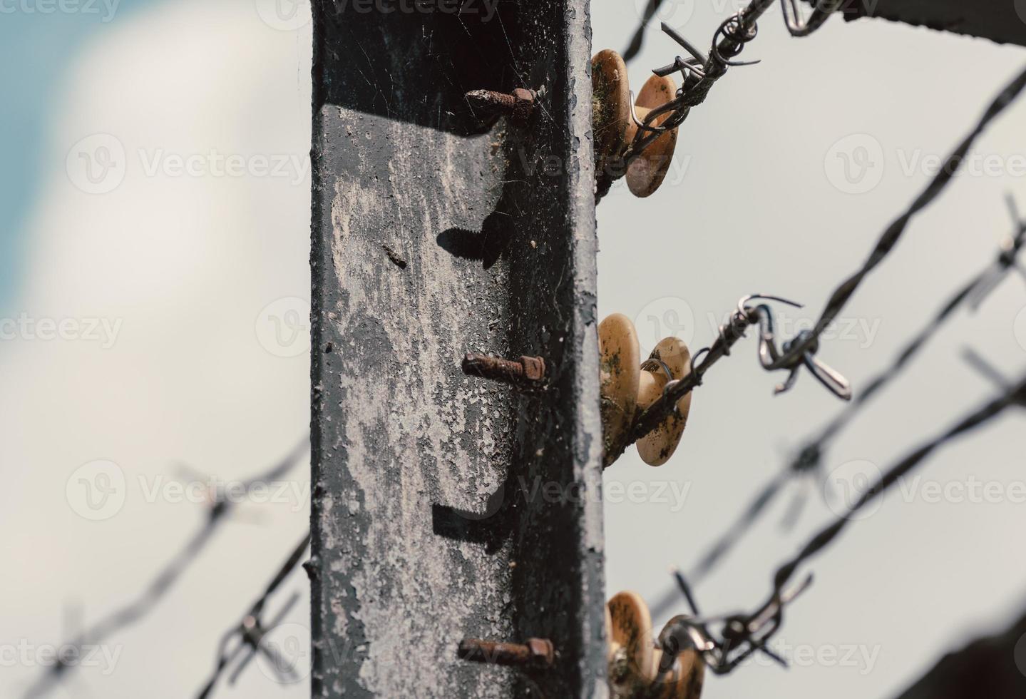 Metal fence post with connectors and wire photo