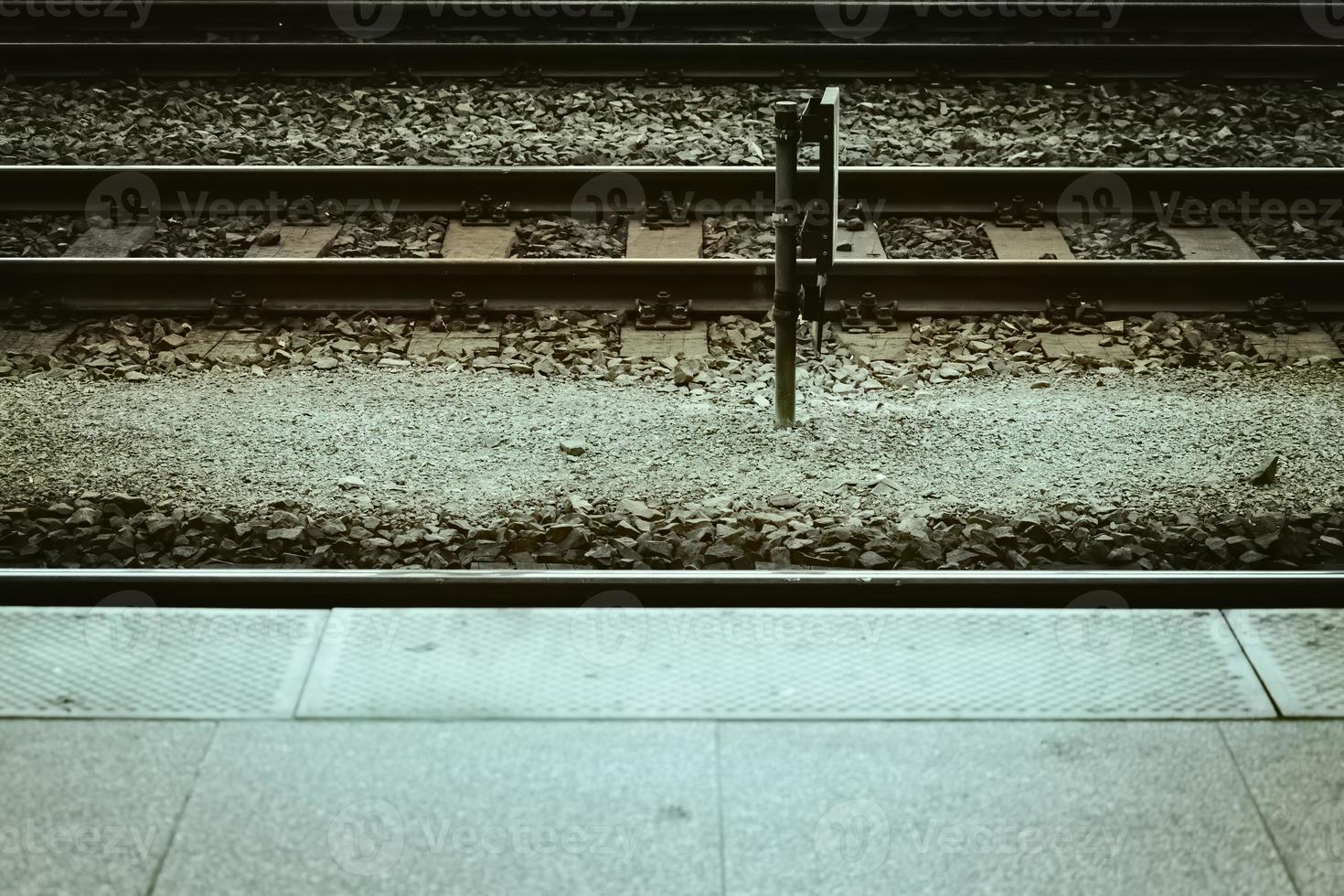 a train track on a platform photo
