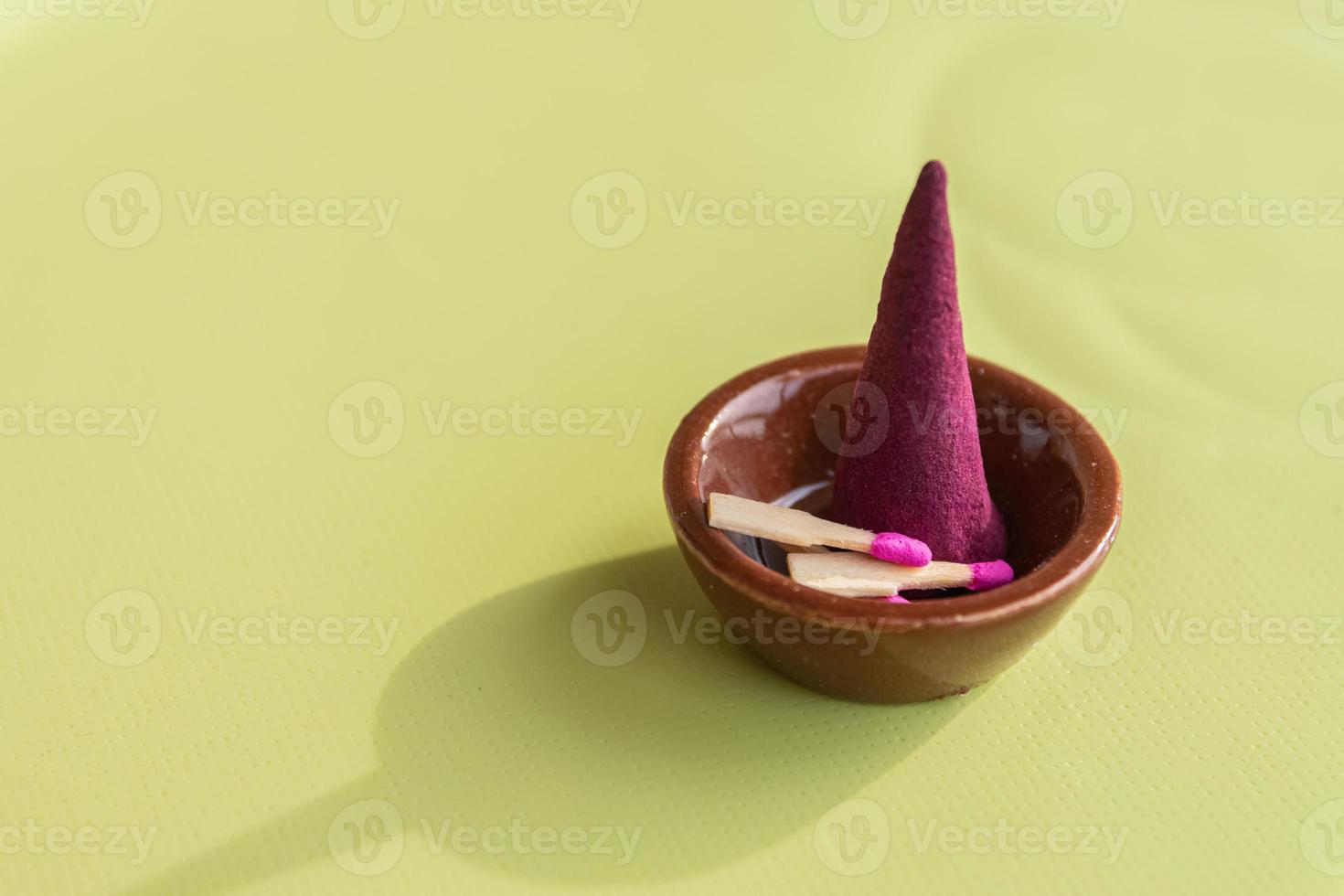 incense cones and matches on a table photo