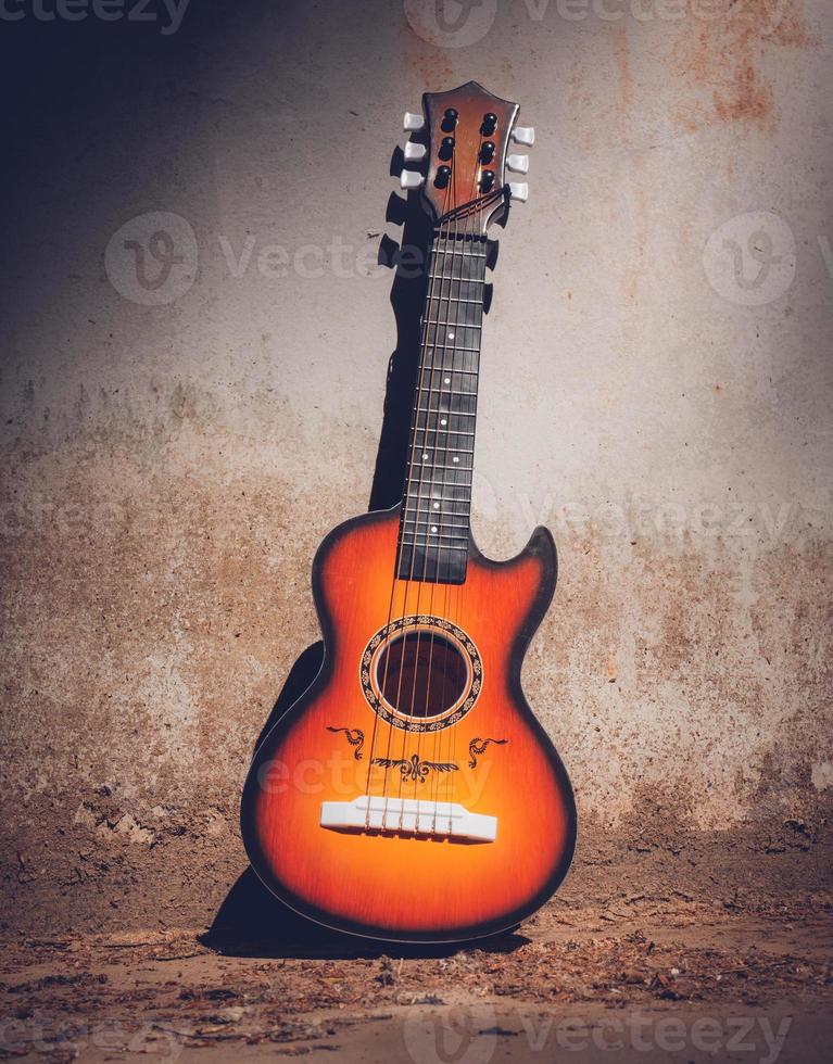 Wooden acoustic guitar outdoors in a street photo