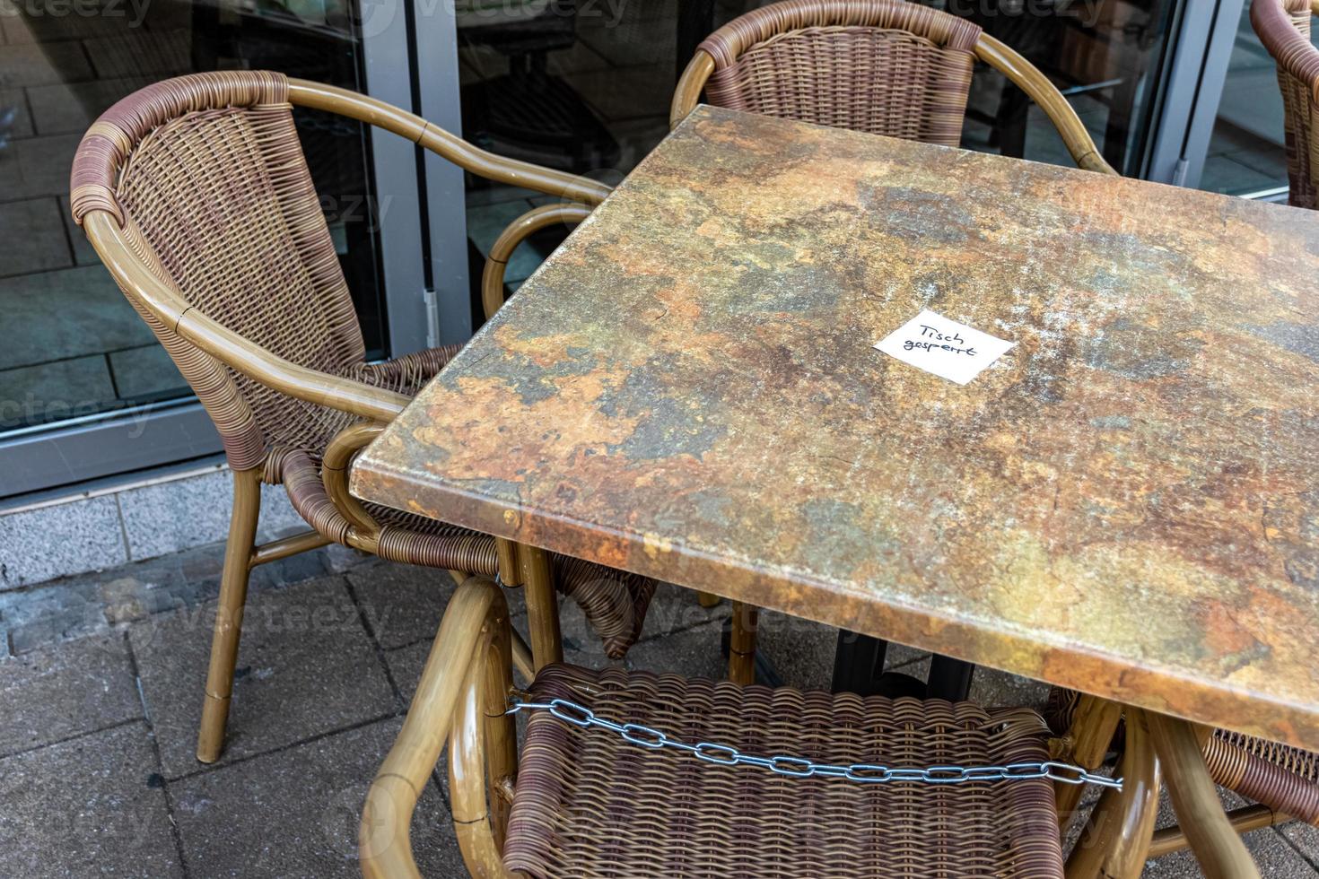 locked chairs in a city as a result of the corona virus photo