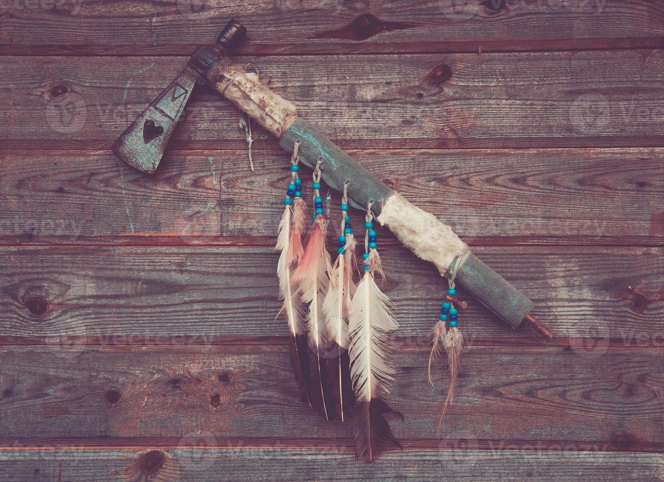 axe indians on a wooden wall photo