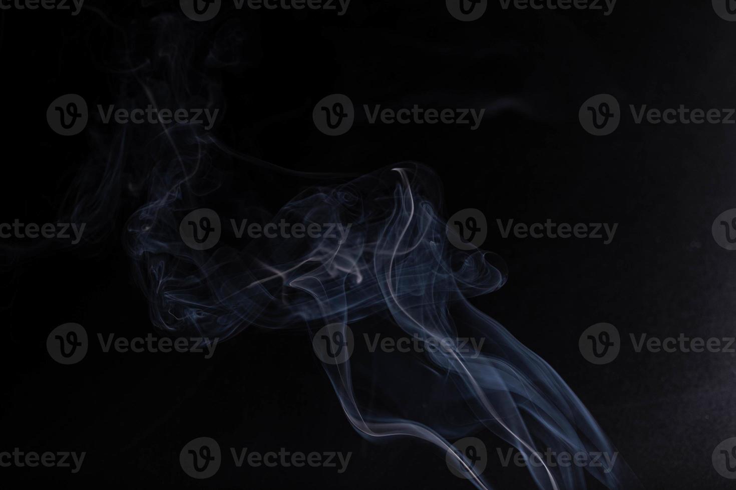 white smoke on a black background photo