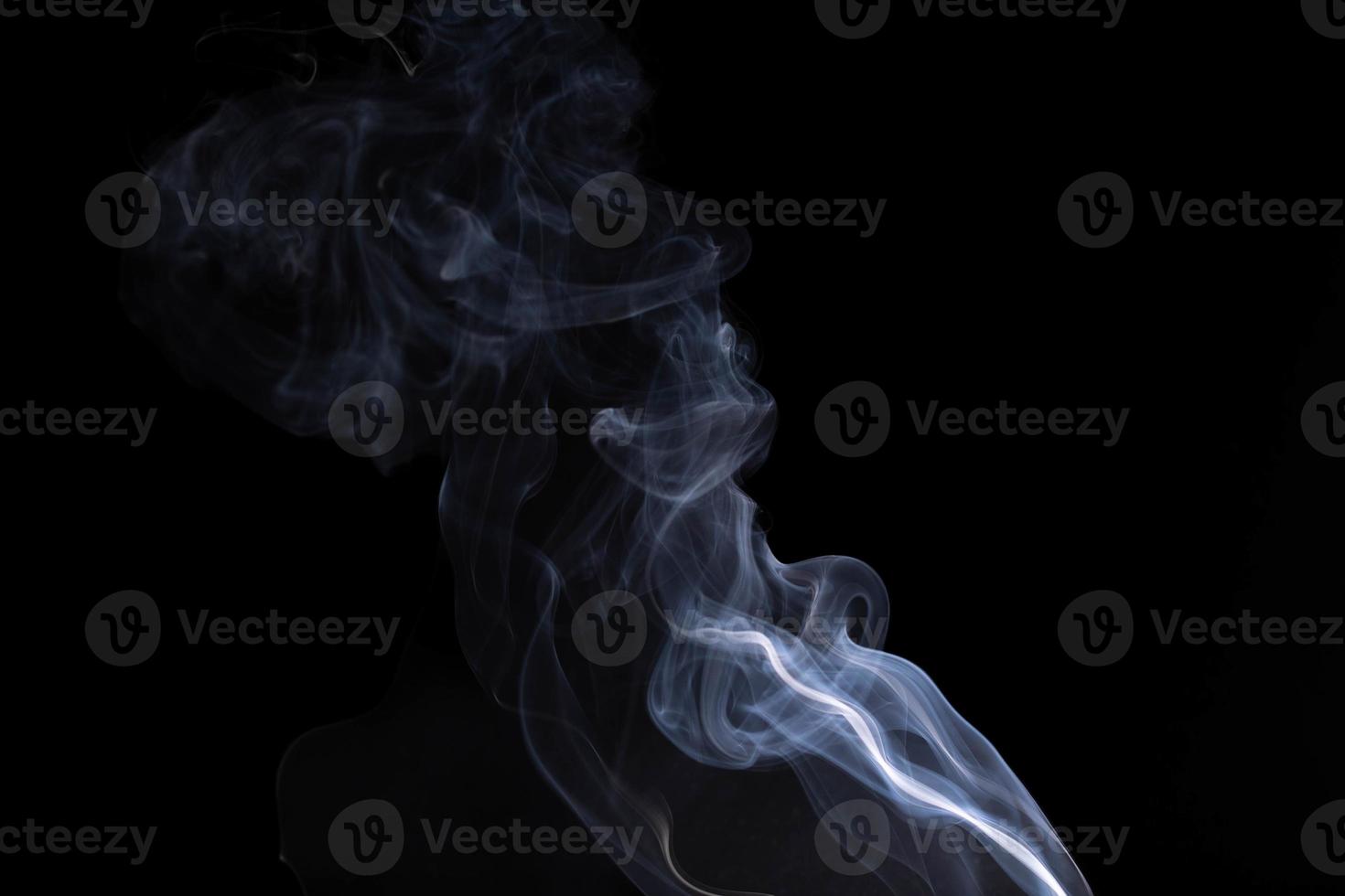 white smoke on a black background photo