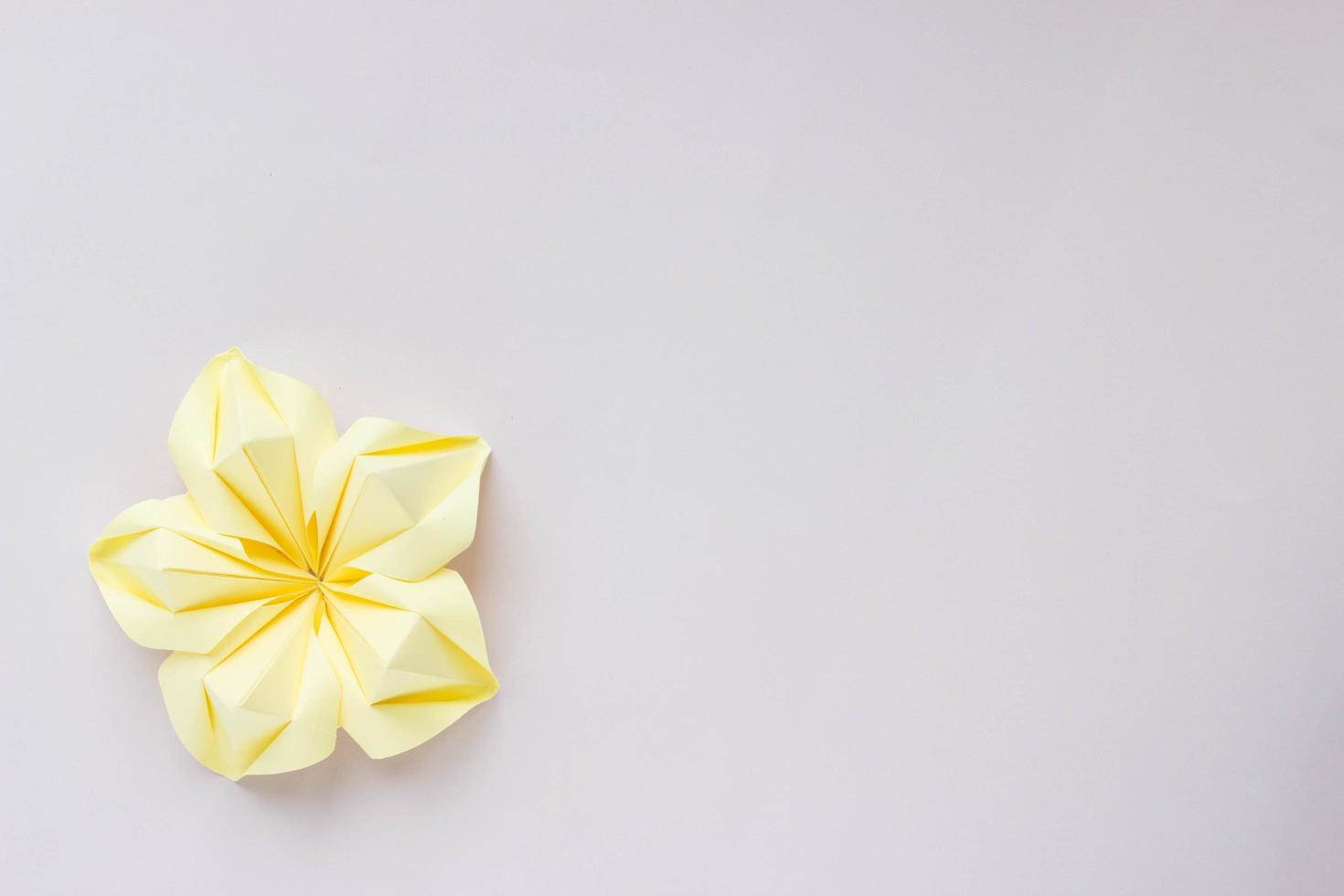 Banner with single yellow origami flower. With space for your design photo