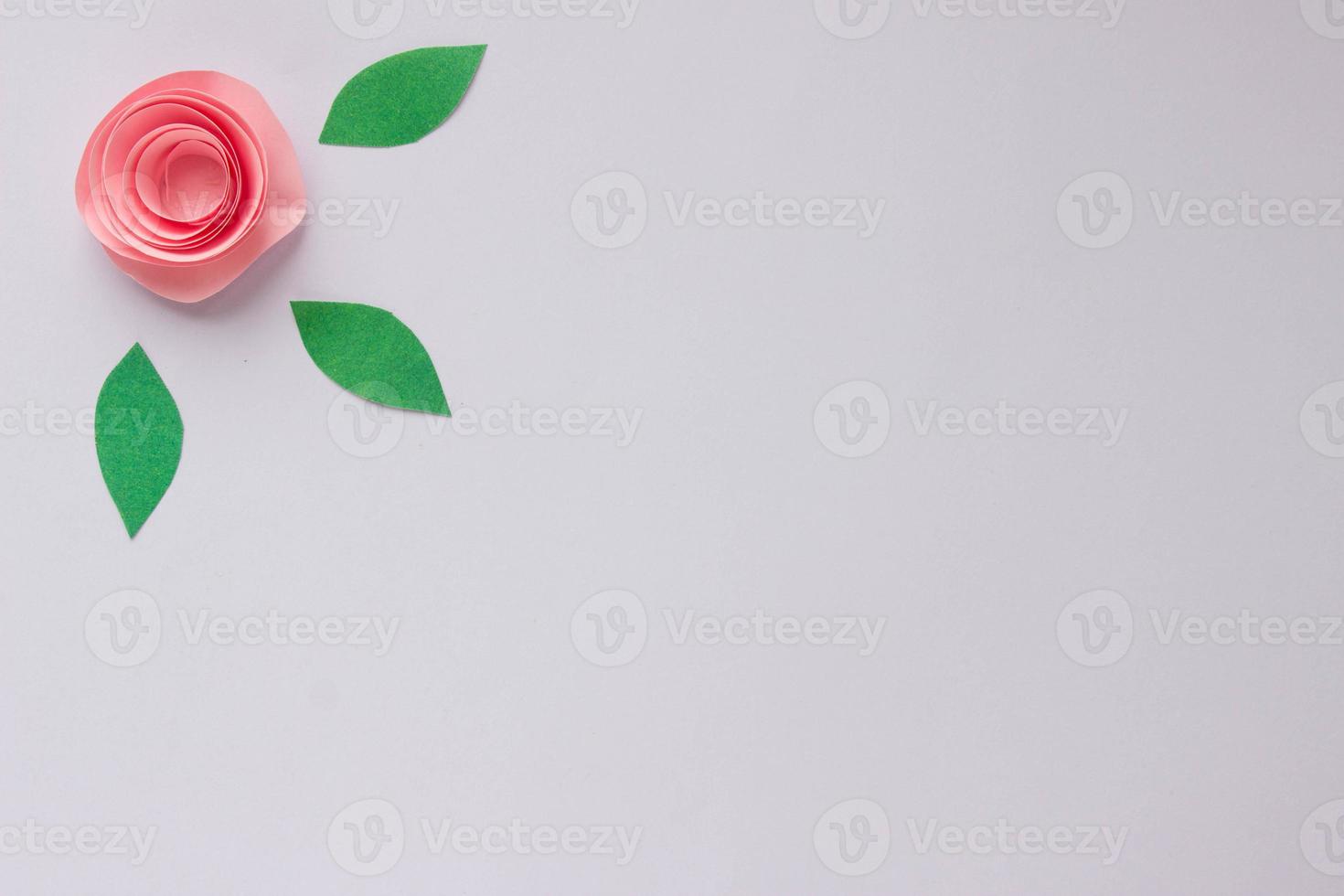 Banner with origami rose and paper leaves with place for your design. Paper background photo