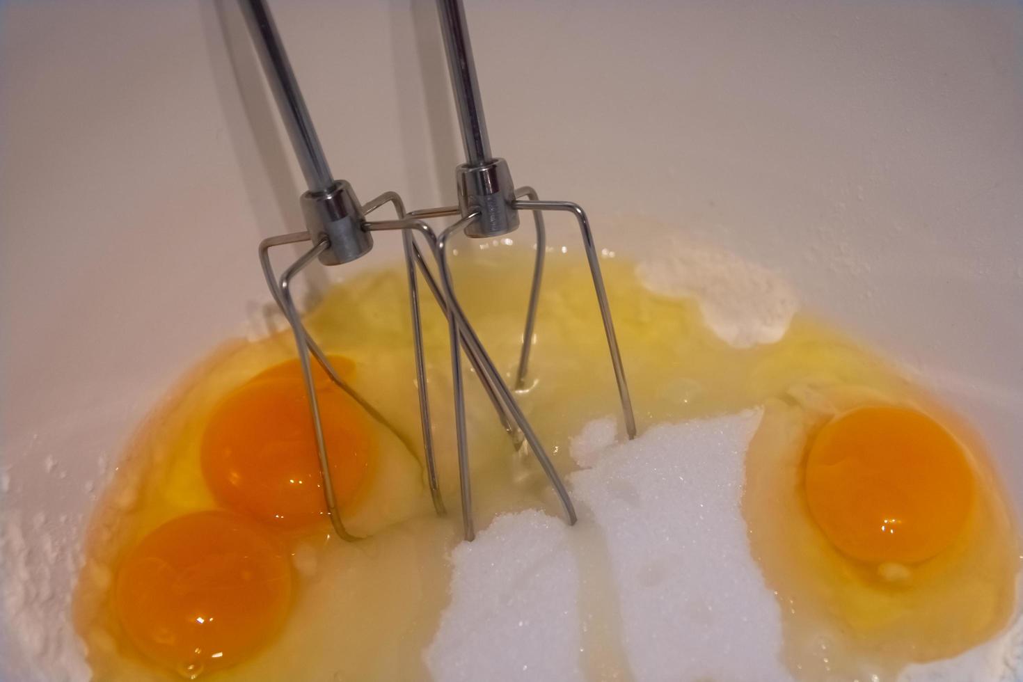 mixing sticks with flour and eggs photo