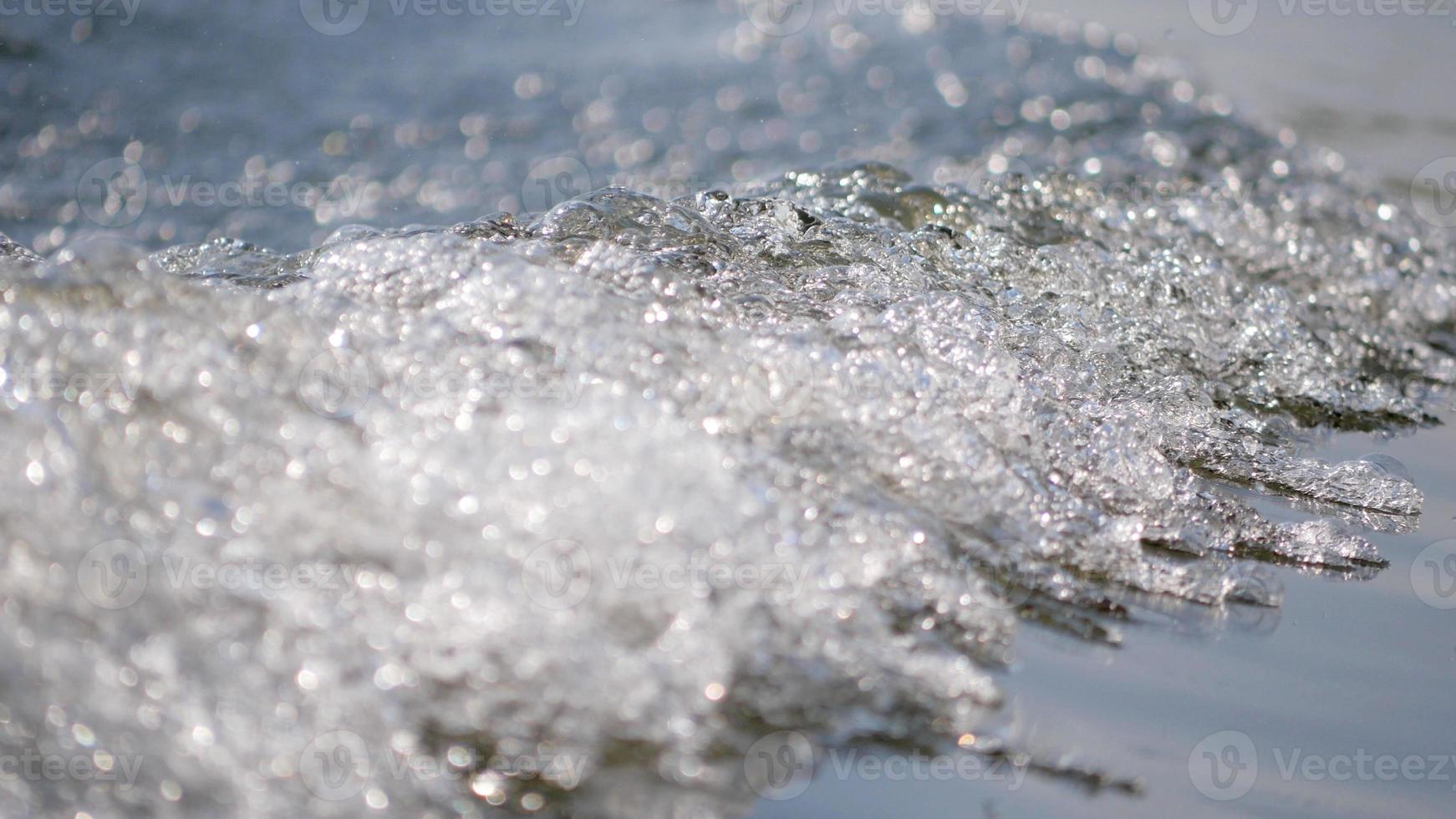 waves and sponges from sailing with bokeh and blurred background photo