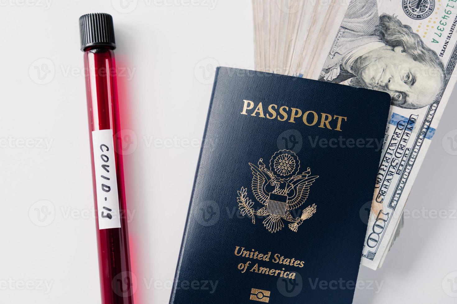 Coronavirus and travel concept. Blood samples, passport and money isolated on white background. Canceled flights because of world pandemic. Virus outbreak photo