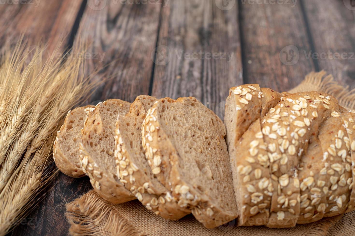 breads sliced and wheat on the sack photo