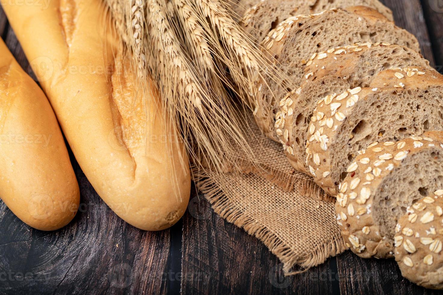 Breads and wheatgrass on the sack photo