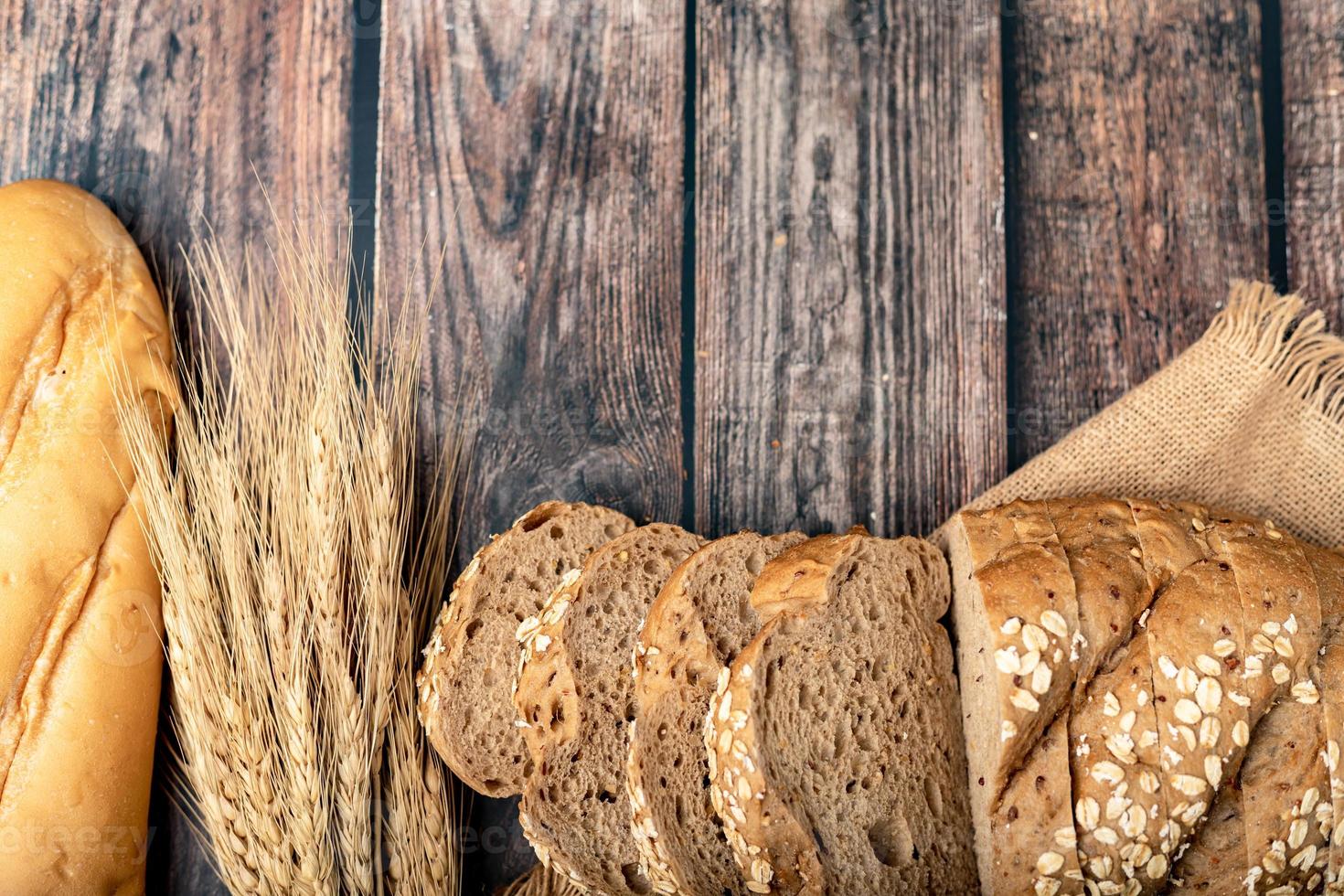 breads sliced and wheat on the sack photo