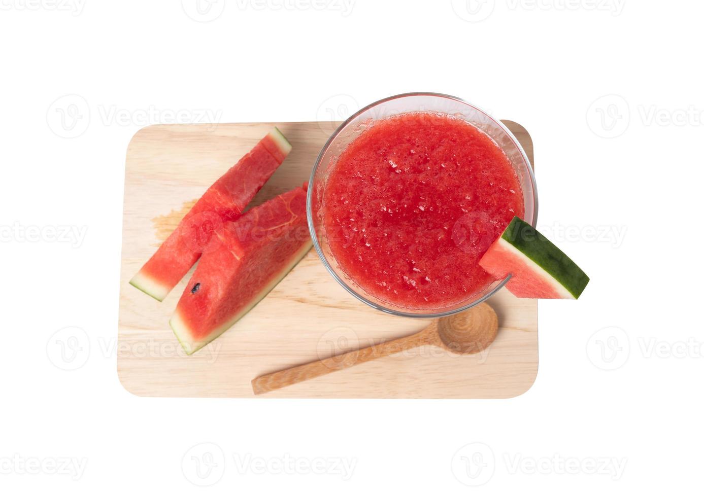 The watermelon in glass blended and sliced on a wooden photo