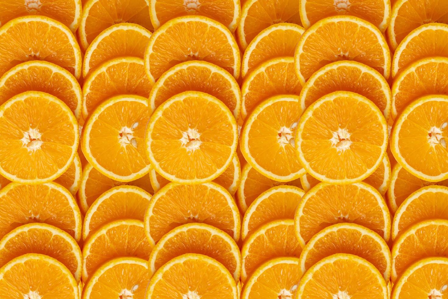 Backgrounds and textured of orange fruits line up in full frame photo