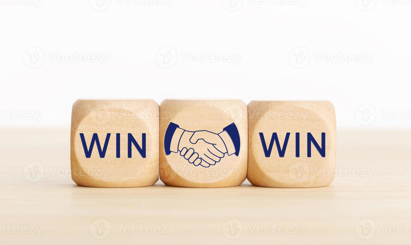 Win Win concept. Text and handshake Icon on wooden blocks. Copy space photo