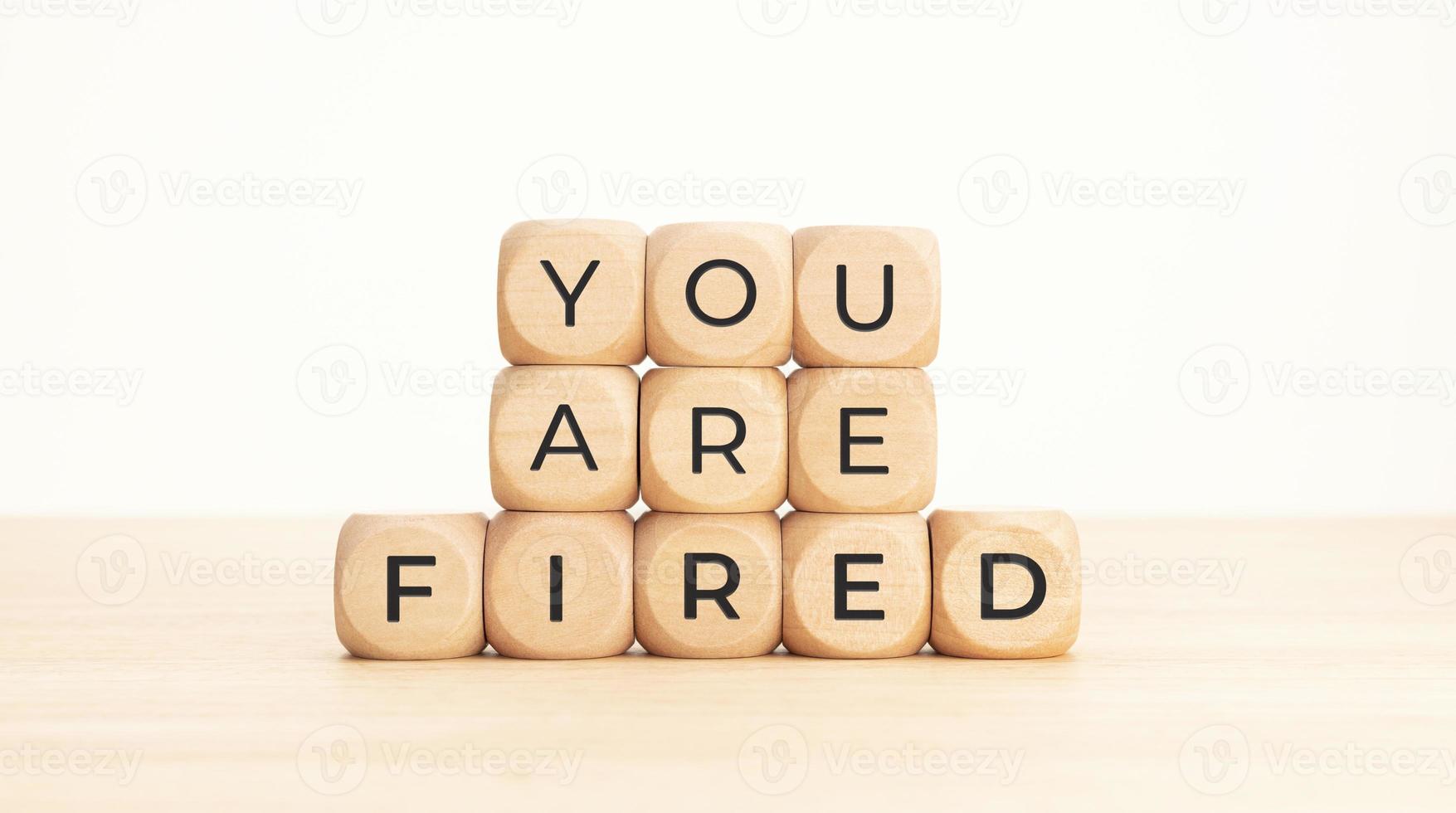 You are Fired phrase on wooden blocks. Unemployed concept photo
