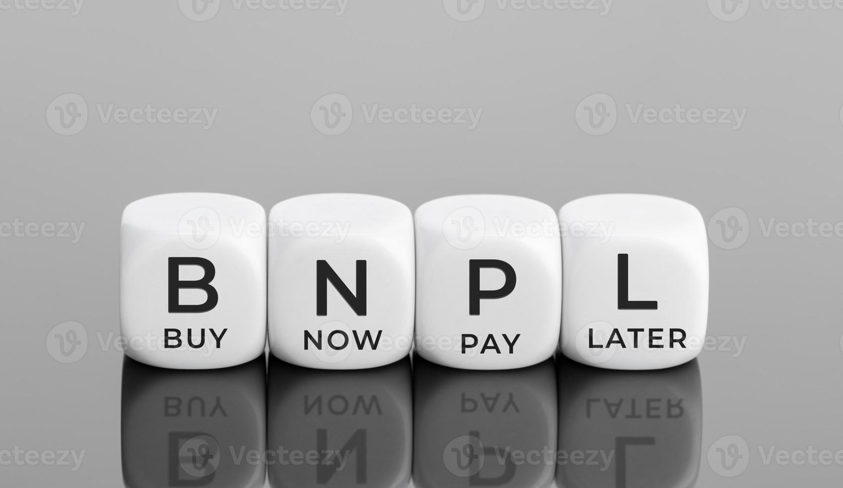 BNPL text on white blocks shape. Buy now pay later concept. Copy space photo
