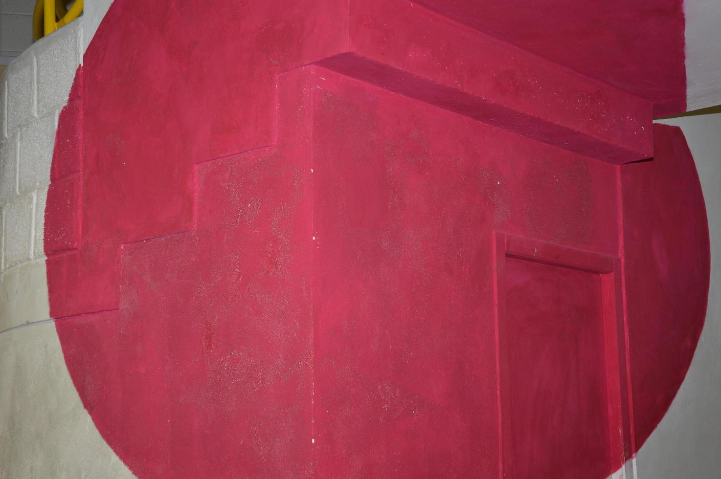 A red circle on a wall photo