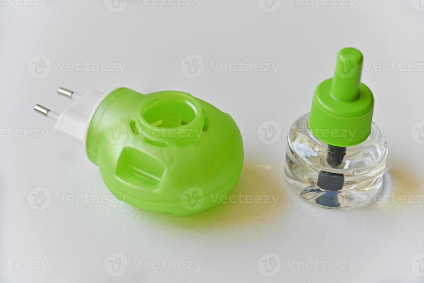 Electric mosquito Repellent fumigator on a white background with liquid photo