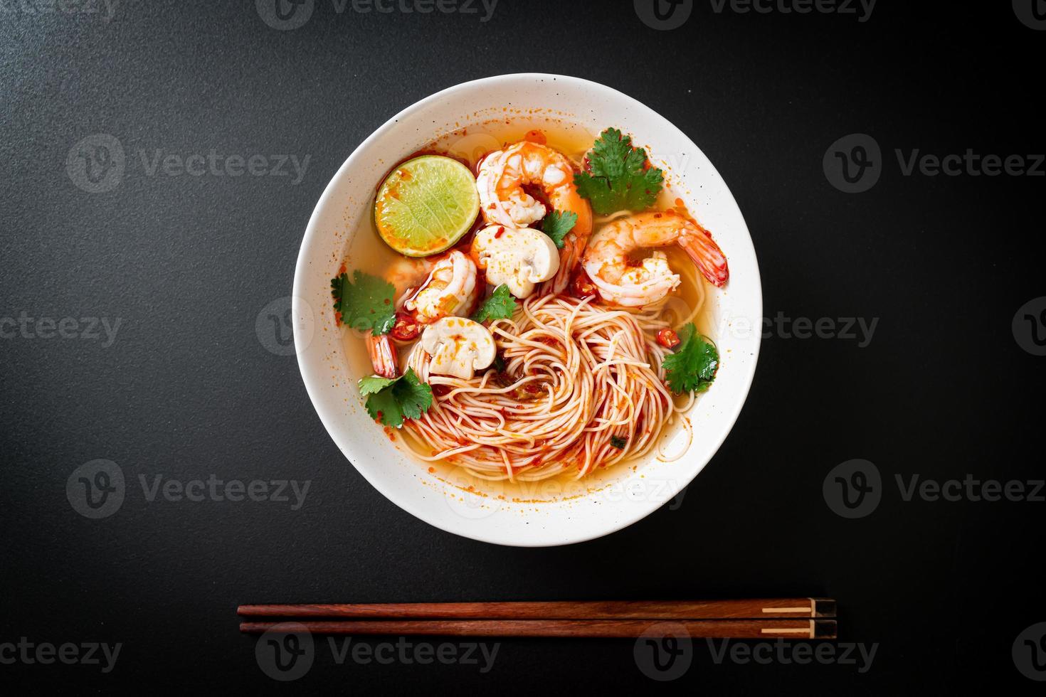noodles with spicy soup and shrimps photo