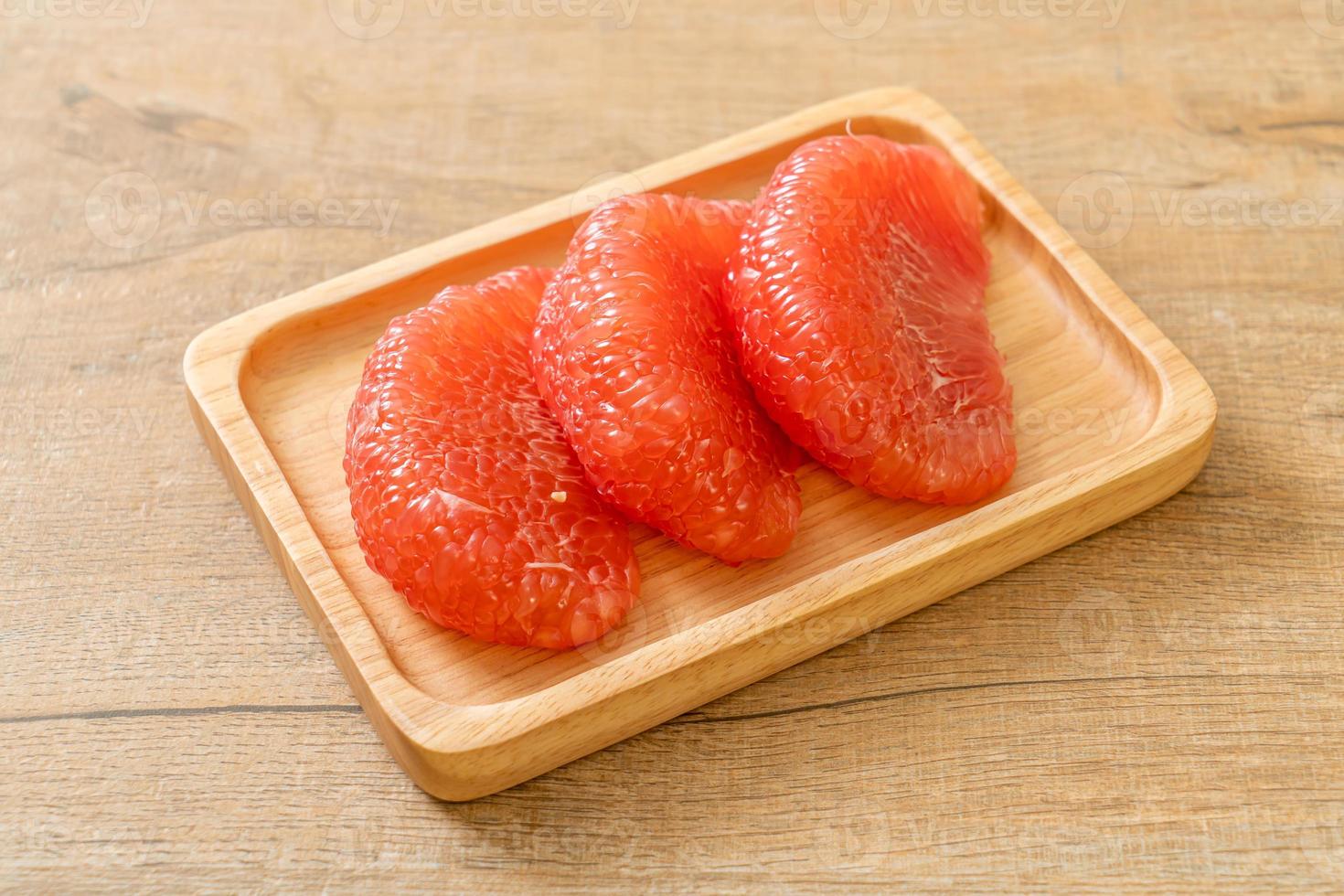 fresh red pomelo fruit or grapefruit photo