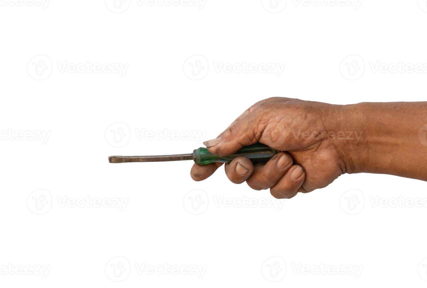 The hand of the mechanic is holding an old screw photo