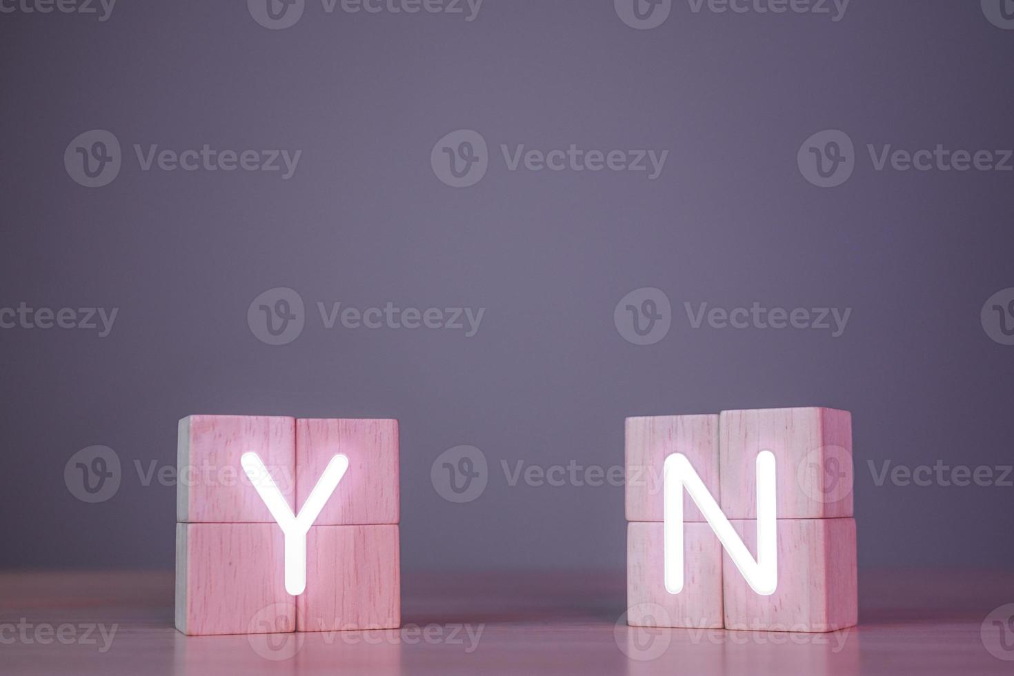 Evaluation and decision concept. Y means Yes. N means No. True and false symbols. Close up wood blocks in cyberpunk tone with copy space. photo