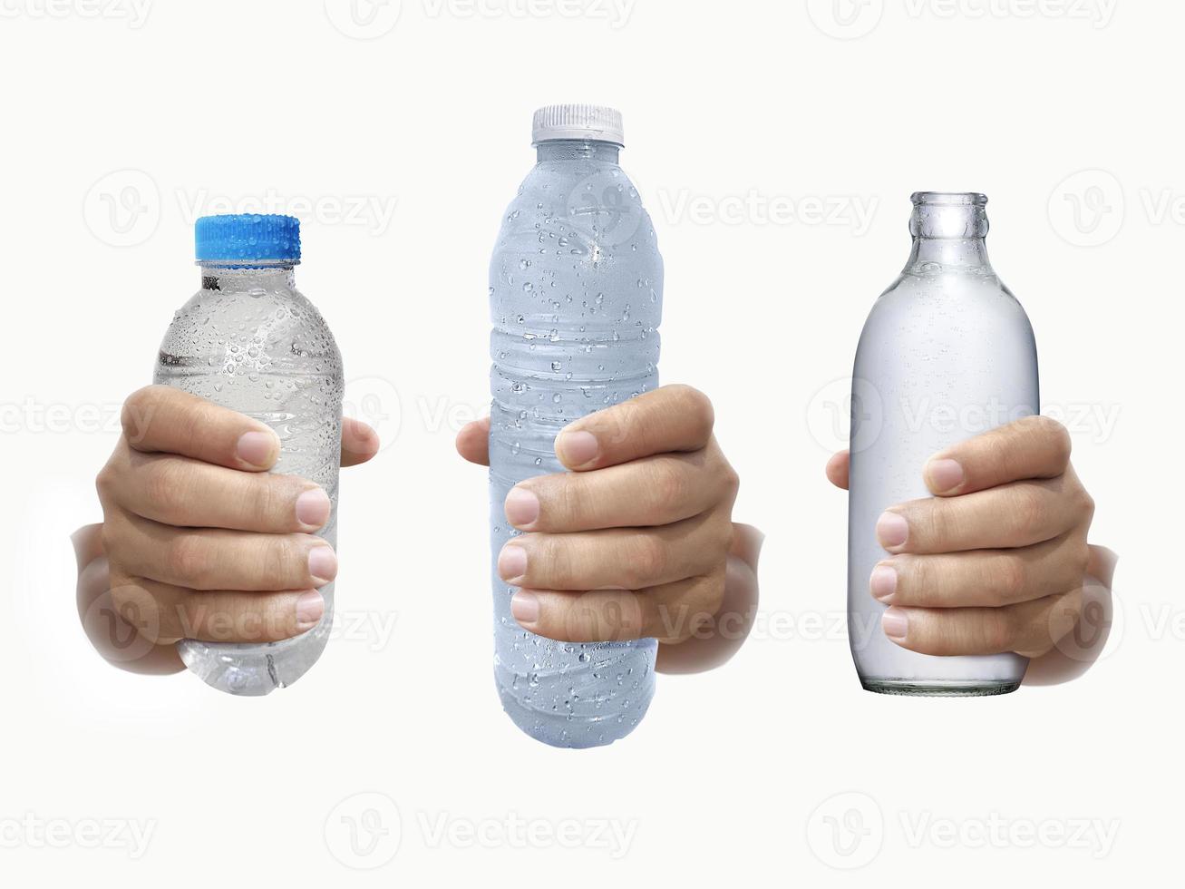 Bottle of water in hand isolated on white background photo