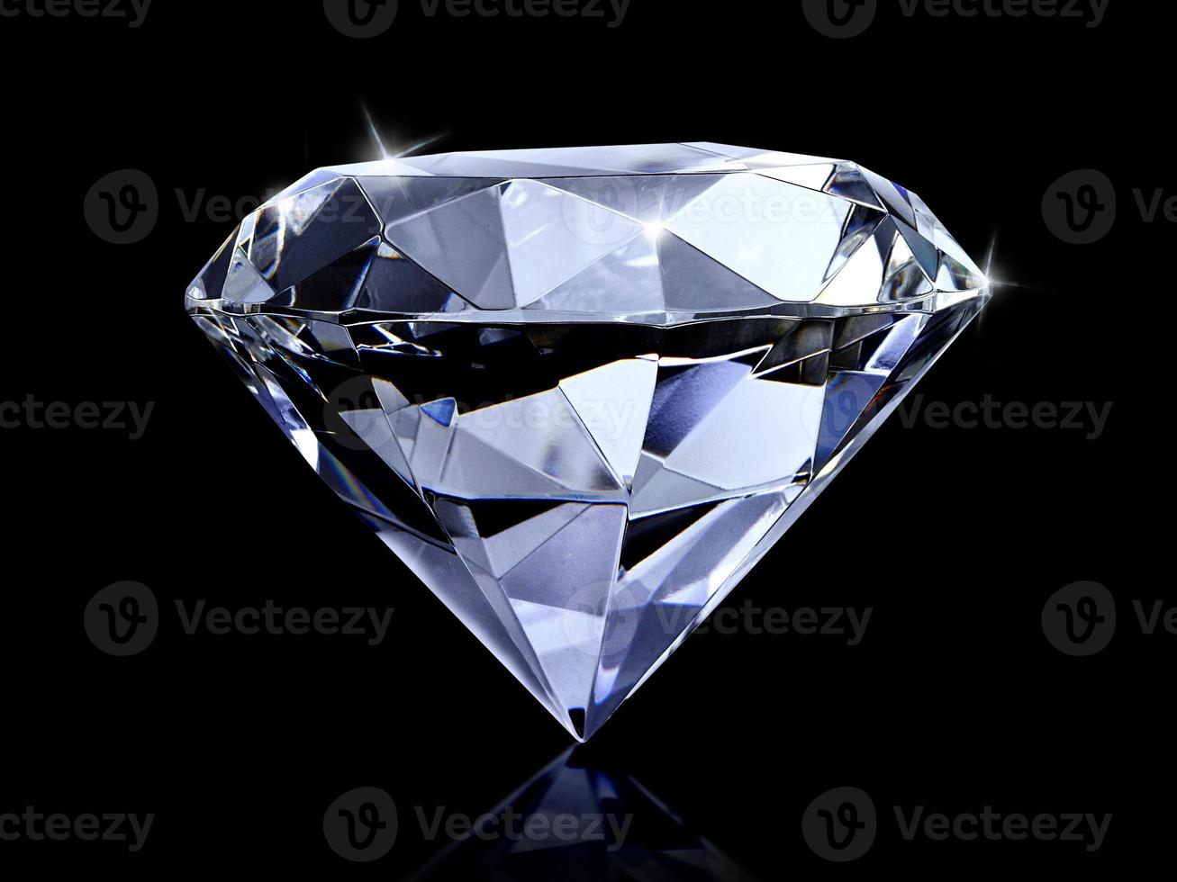 Dazzling diamond on black background photo