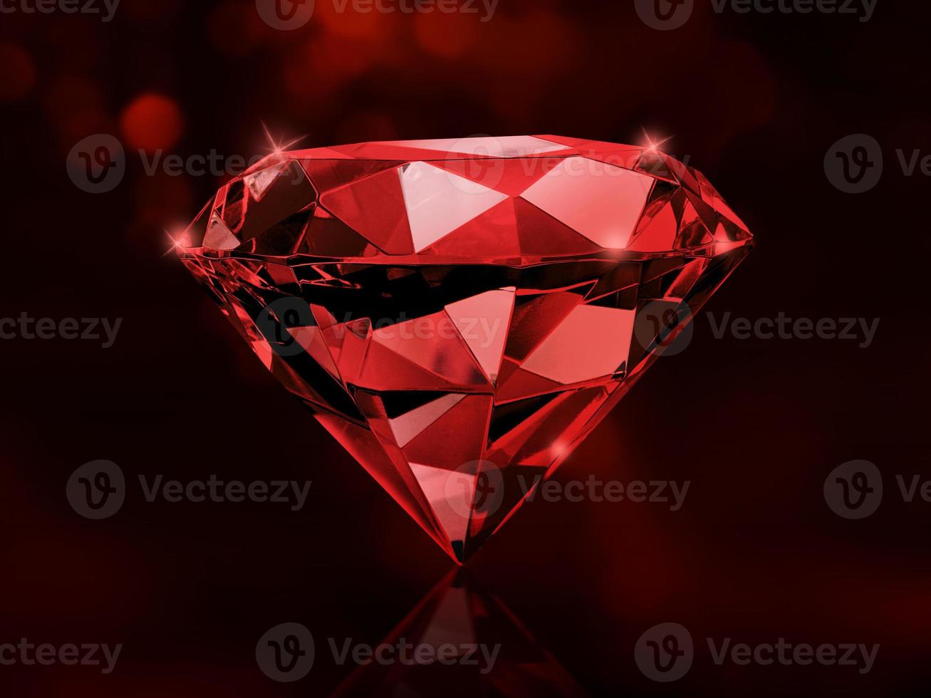 Sparkling red diamonds on a dark red glowing bokeh background. photo