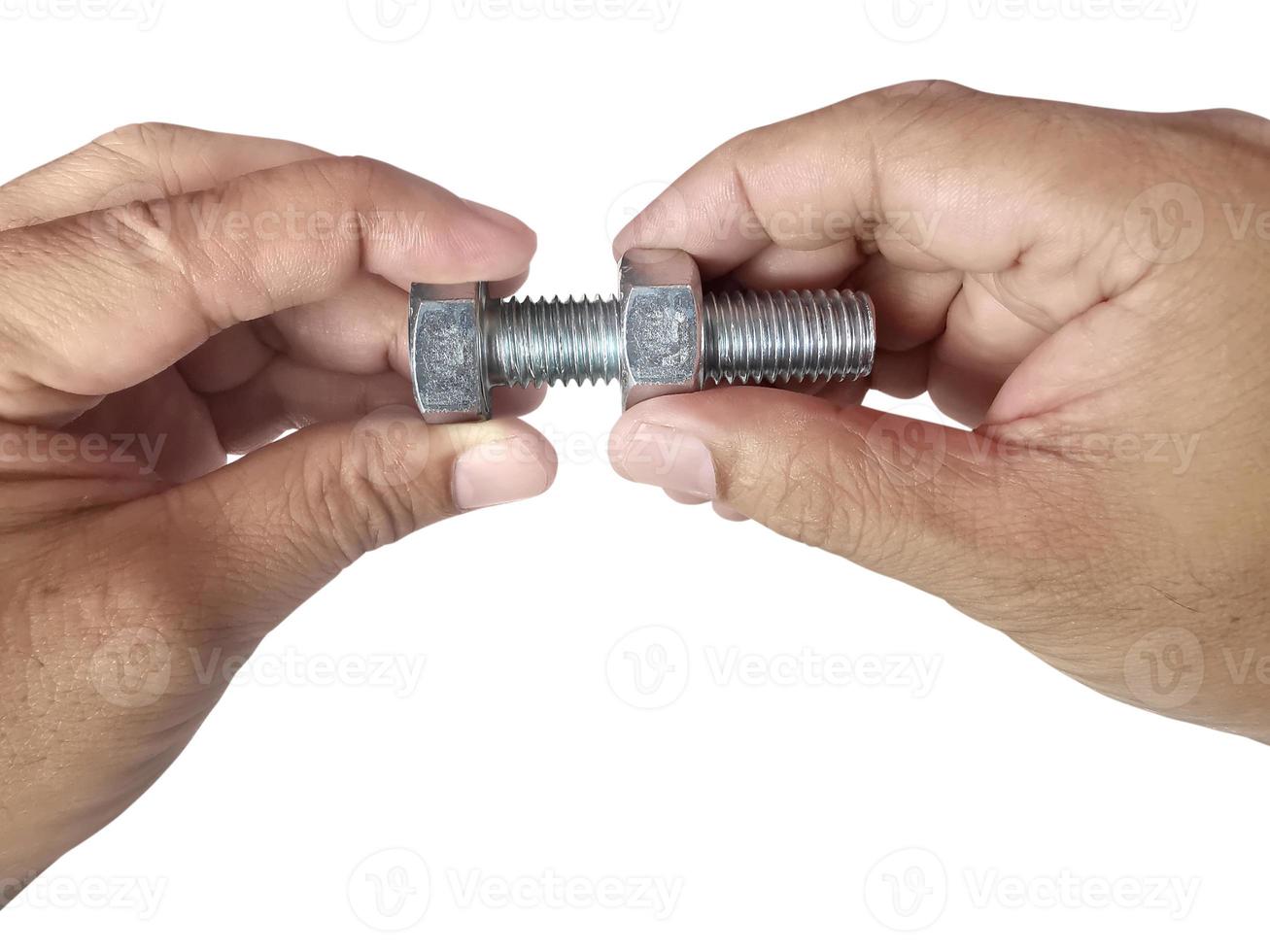 Nut and screw on hand on white background photo