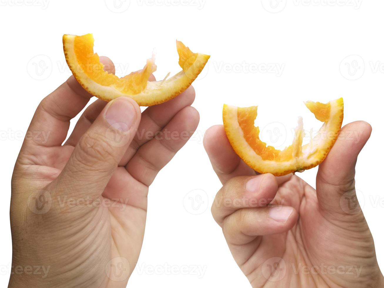 hand holding slice of orange isolated on white background photo