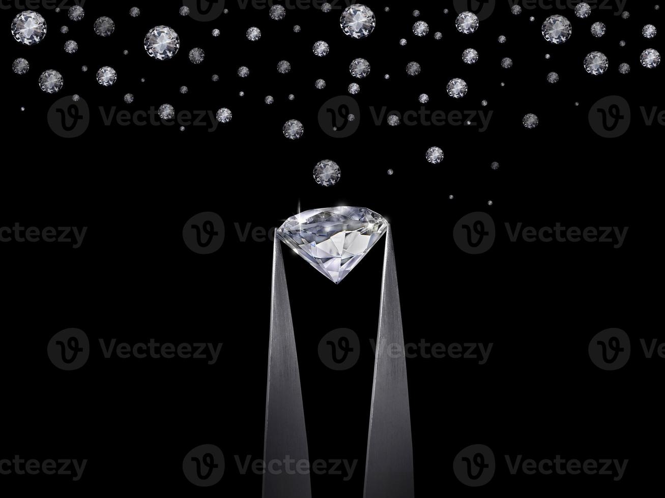 Diamond in tweezers on a black background with diamonds group soft focusing photo