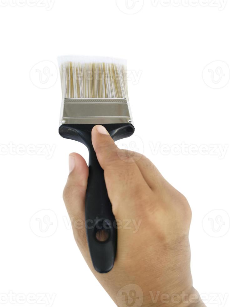 hand holding Paintbrush isolated on white background photo