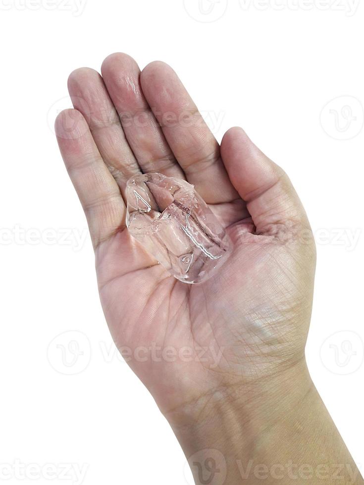 ice cubes on hand. isolated on a white background photo