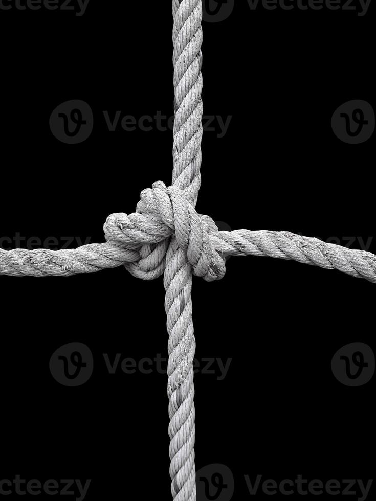 Rope knot on black background. Concept for unity photo