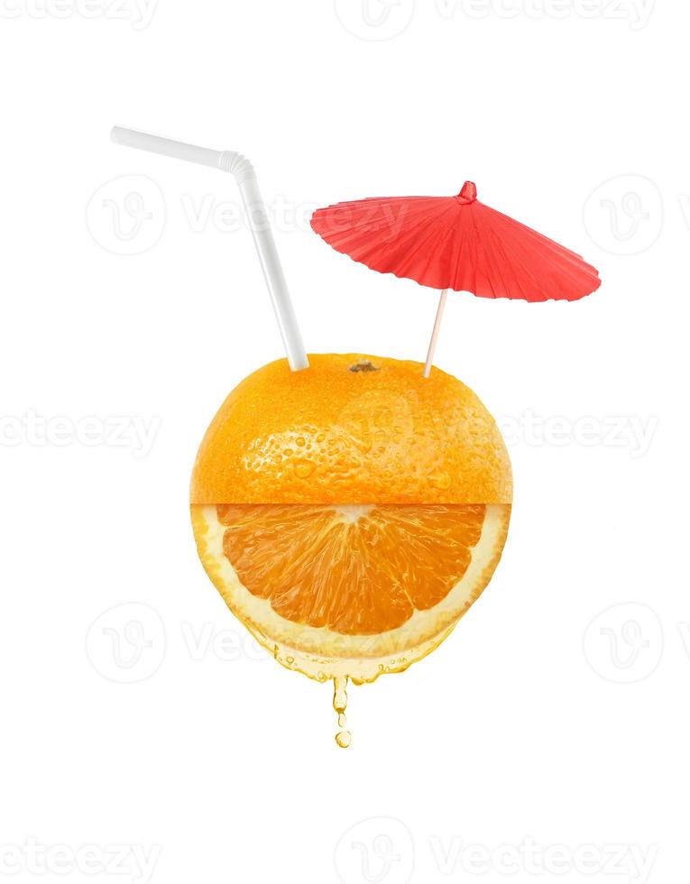 Orange juice with straw and umbrella on orange fruit. Flat lay. Food concept photo