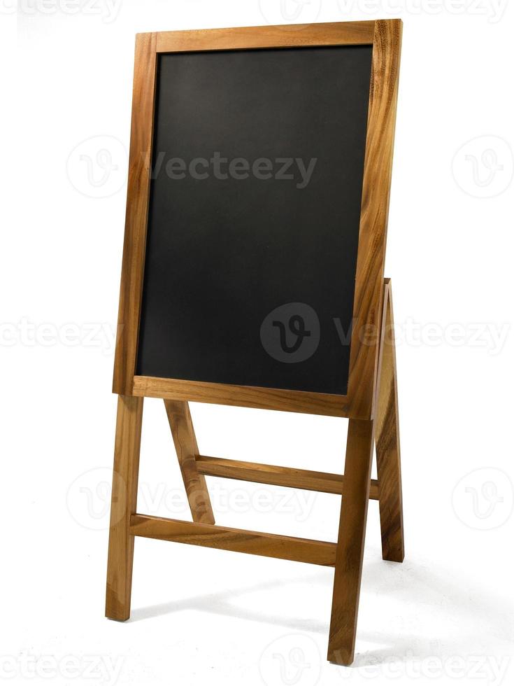 Wooden rustic blackboard in front of restaurant entrance. Mock up Menu Blank Blackboard sign stand Shop Cafe Restaurant. Street Magnetic Sidewalk Chalkboard photo