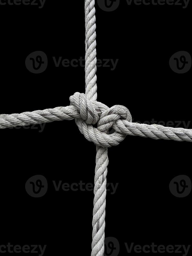 Rope knot on black background. Concept for unity photo