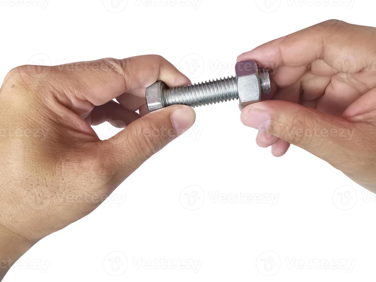 Nut and screw on hand on white background photo