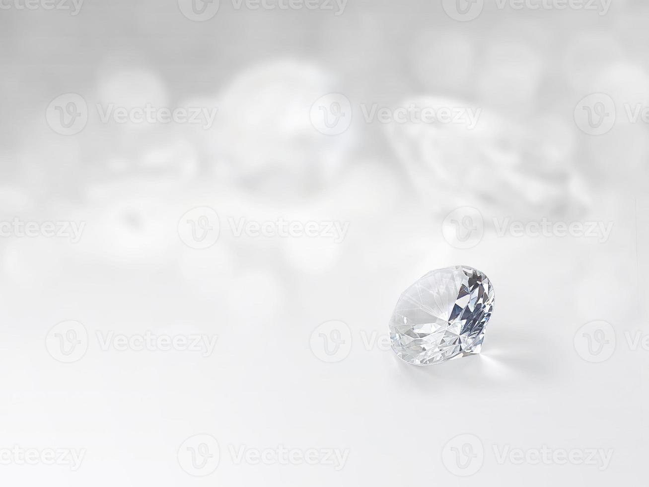 still with expensive cut diamonds in front of a white background, reflections on the ground. photo