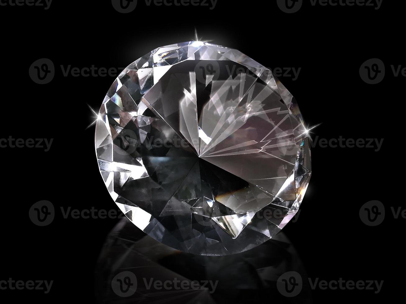 Dazzling diamond on black background photo