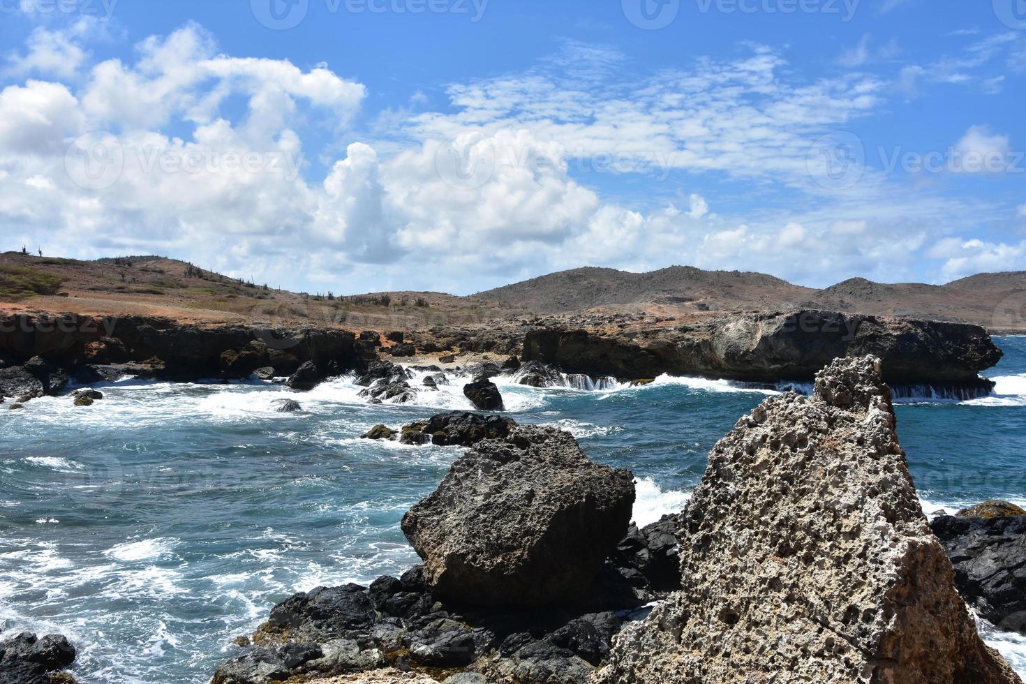 Lava Rocks On Black Stone Beach in Aruba photo