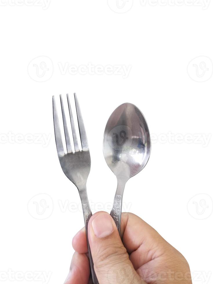 Hand hold Stainless steel fork and spoon isolated on white background photo