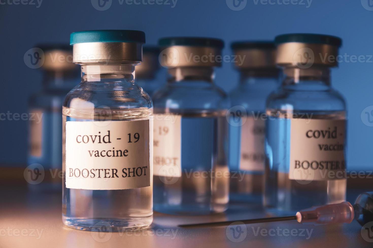 COVID-19 booster vaccine vial. Medicine and health care concept photo