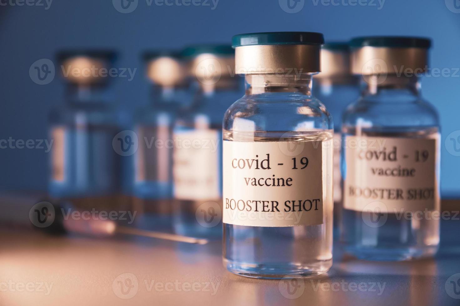 COVID-19 booster vaccine vial. Medicine and health care concept photo