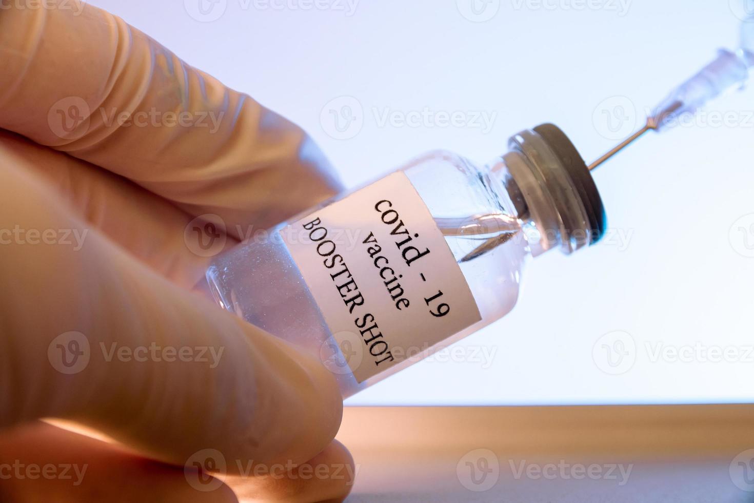 COVID-19 booster vaccine vial. Medicine and health care concept photo